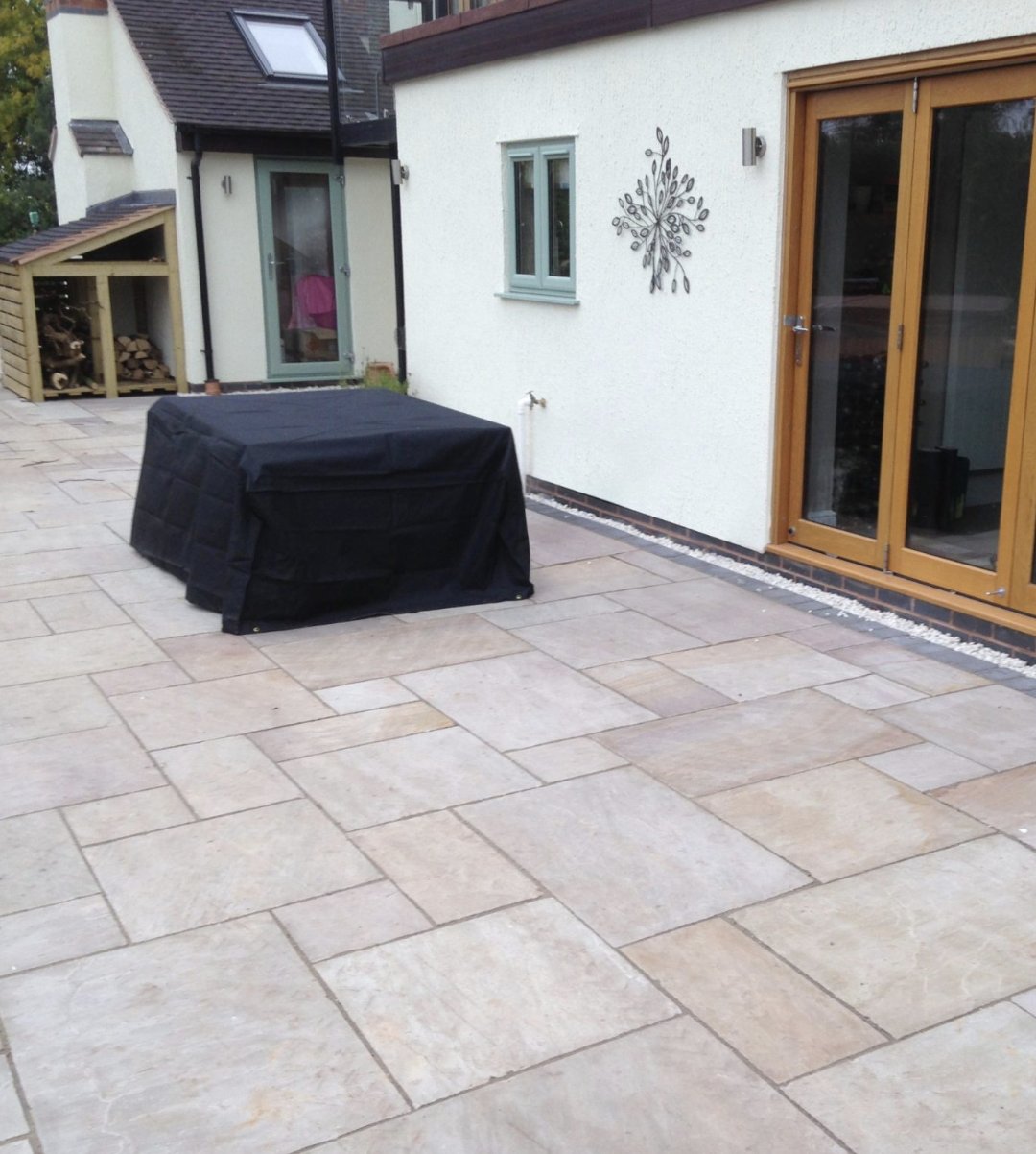 a grey sandstone paving outdoor area