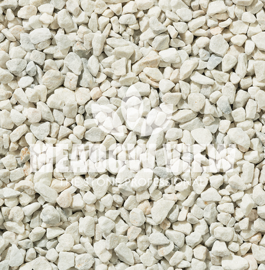 A close-up of a surface covered with small, light-colored pebbles, with text overlaid reading "PAVING SHOPPER" with a leaf and tree logo above and "Alpine White Chippings - 3-8mm" below.