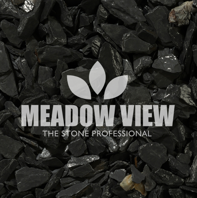 A close-up view of Black Slate Chippings - 20mm with the Paving Shopper logo and tagline "The Stone Professional" superimposed on the center.