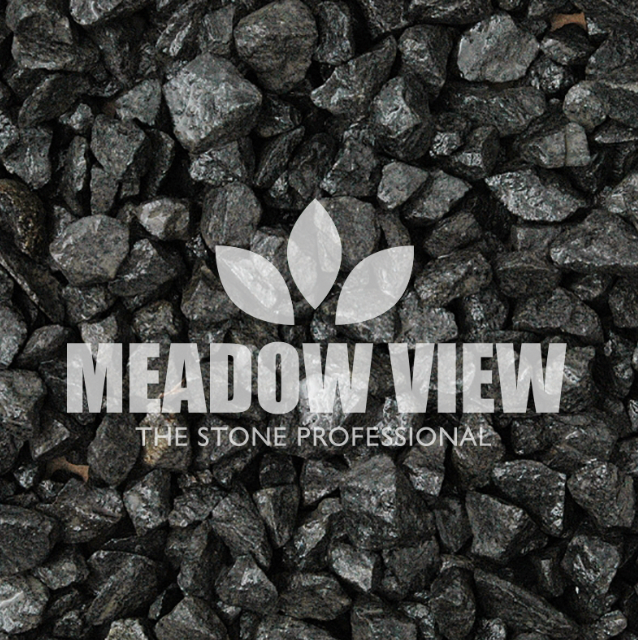 A pile of small, black stones, labeled "Paving Shopper Ebony Black Chippings - 20mm" with a leaf logo and the slogan "THE STONE PROFESSIONAL" overlaid on top.