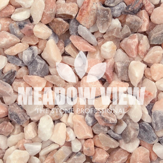 Close-up view of a pile of multicolored gravel with the text "Paving Shopper Flamingo Chippings - 20mm" overlaid on the image.