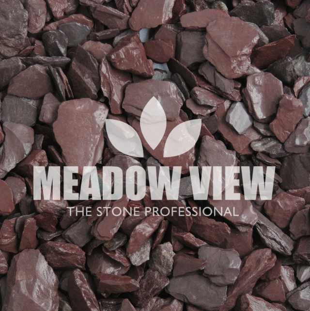 Close-up view of a pile of plum-colored decorative stones with the "Paving Shopper" logo overlaying the image.