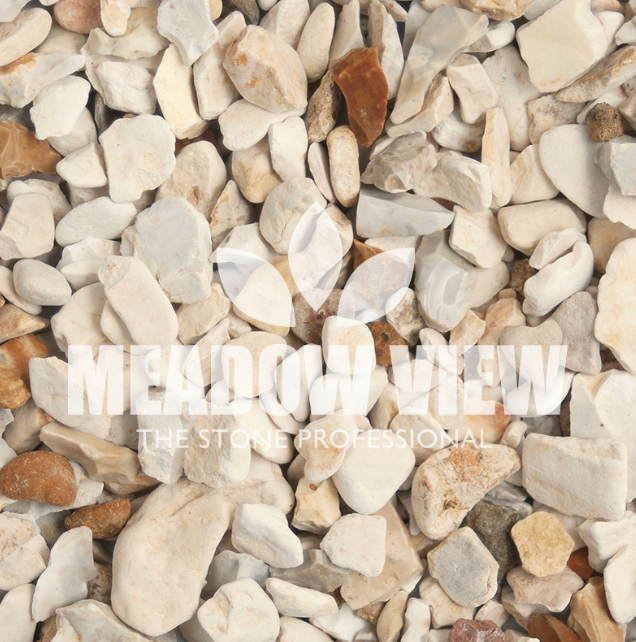 Image showing a pile of the Yorkshire Cream Chippings - 15-30mm in various shades of white, tan, and brown with "Paving Shopper" text and floral logo superimposed. Text below the logo reads, "THE STONE PROFESSIONAL.